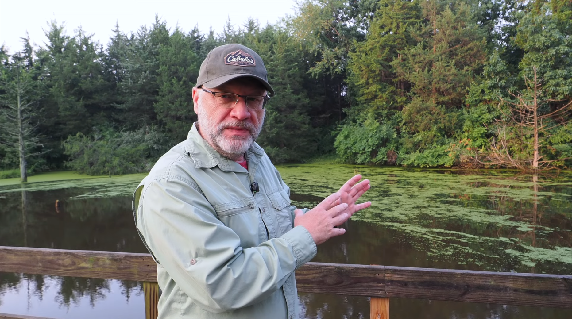 Mark from KLM Ponds discussing pond management beside a pond